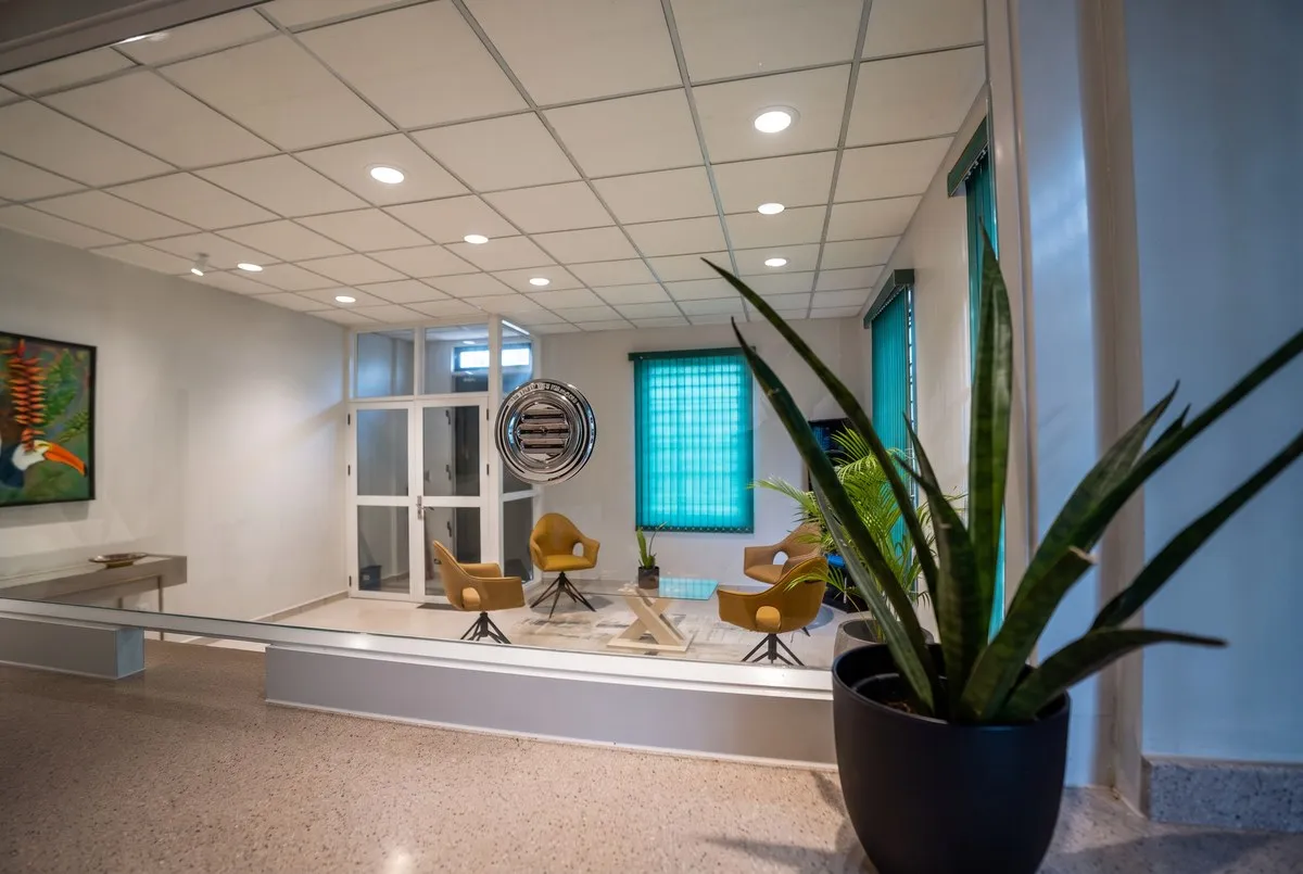 Reception window and waiting lounge at the AZERRA office, Keizerstraat 16, Paramaribo